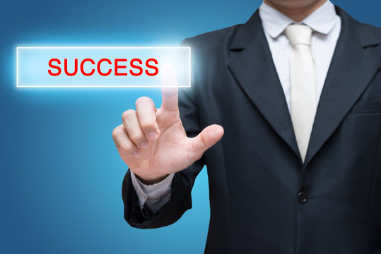 Businessman pressing success button isolated