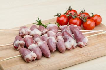 Raw chicken hearts for barbecue