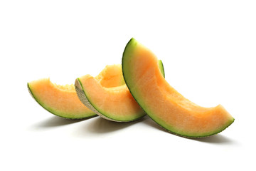 cantaloupe melon slices isolated on white background