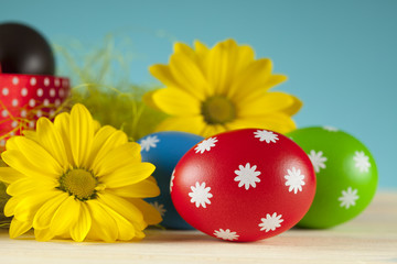 Colored Easter eggs and flowers