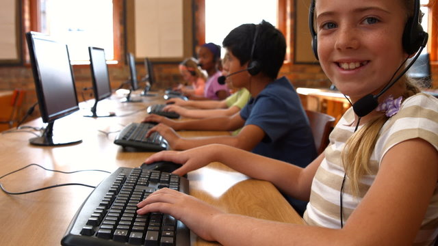 Pupils in computer class at school