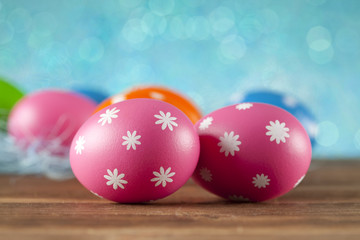 Colored Easter eggs on blue background