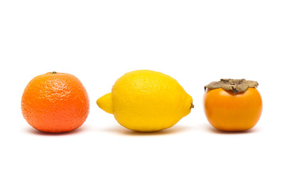 lemon, persimmon and tangerine isolated on white background