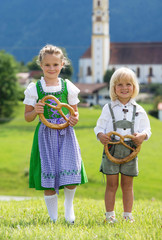 Two little children in traditional German bavarian clothes