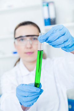 female researcher with  equipment in the lab 