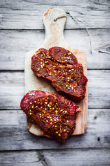 Raw meat on wooden background