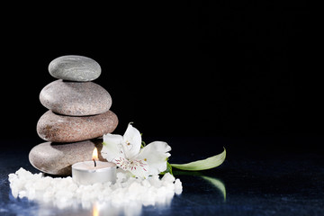 Beautiful composition with spa stones and candle