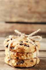 Tasty cookies on rustic wooden background