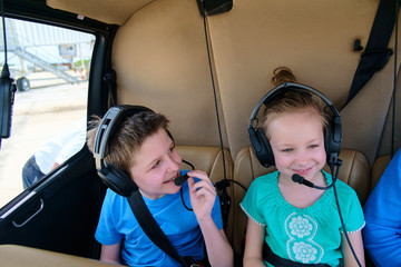 Kids at cabin of helicopter © TravelPhotoBloggers