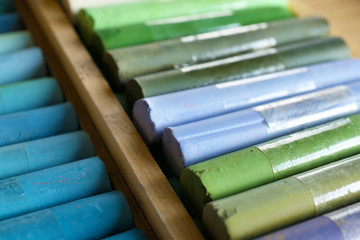 Colorful chalk pastels in box close up