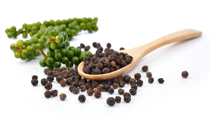 pepper seed in wooden spoon on white background.