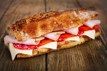 Fresh and tasty sandwich with ham and cheese