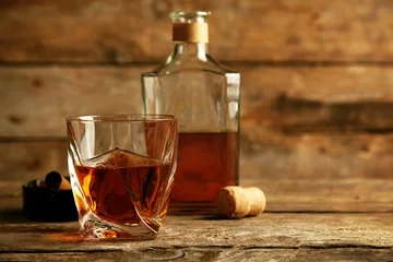 Rolgordijnen Bar Whiskey on wooden background