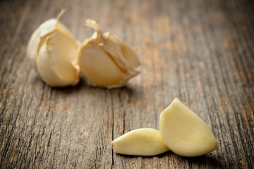 Fototapeta na wymiar Garlic on wooden background