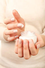 Female hand with cream, closeup