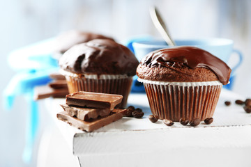 Tasty homemade chocolate muffins and cup of coffee