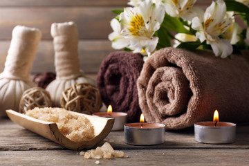 Beautiful spa composition with flowers on wooden background