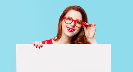 girl in red dress and glasses with white board