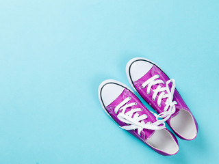 purple gumshoes with white shoelaces