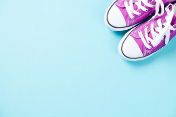 purple gumshoes with white shoelaces