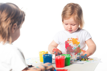 Obraz na płótnie Canvas Children playing with finger paints