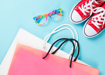 Red gumshoes with shpping bags and glasses