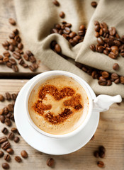 Cup of coffee on old wooden table