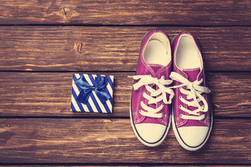 Gumshoes with white shoelaces and gift box