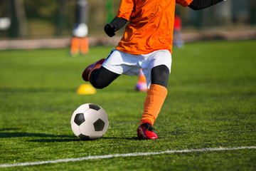 Obraz premium Football soccer match for children. Boys playing football