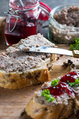 spreading chicken liver or goose pate on wholegrain bread
