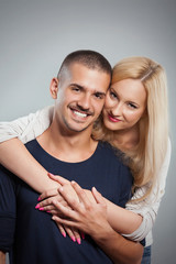 Portrait of happy young couple embracing