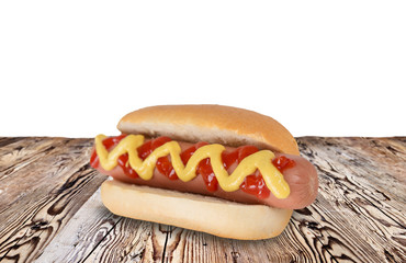 Hot dog on wooden table.