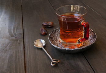cup of tea, cinnamon, anise, teapot and flowers