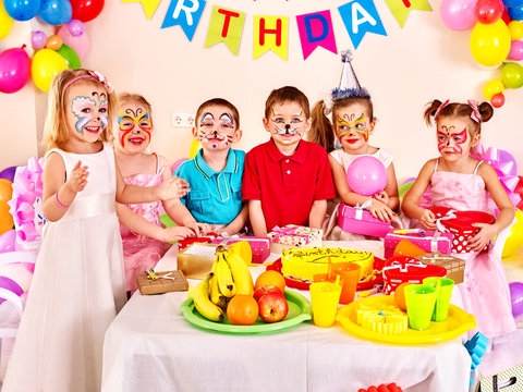 Children happy birthday party eating.