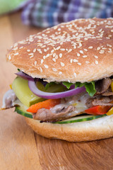 philly cheese steak burger sandwich with vegetables
