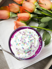 Colorful jelly with whipped cream and candy topping