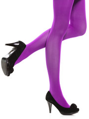 Woman long legs and violet stockings isolated
