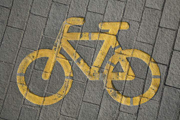 Bicycle way symbol on city street as a background