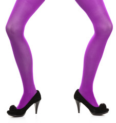 Woman long legs and violet stockings isolated