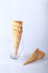 row of ice cream cones on white background