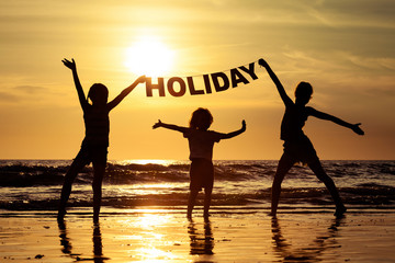 Fototapeta premium Happy children playing on the beach