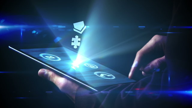 Businessman using tablet to view holographic apps