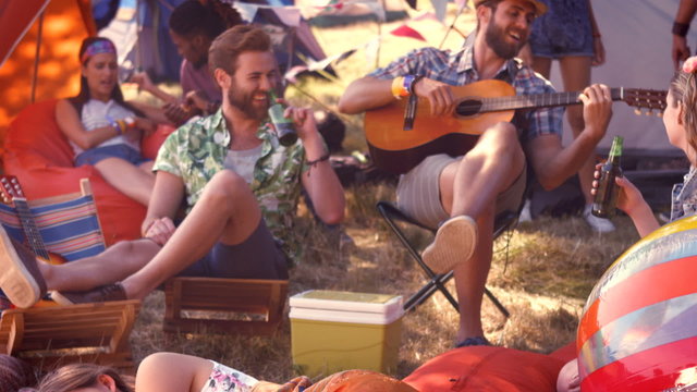 In high quality format pretty hipster relaxing on campsite