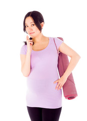 Pregnant asian woman isolated on white fingers crossed for luck