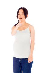 Pregnant asian woman isolated on white scolding upset