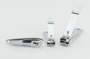 three nail clippers isolated on white background