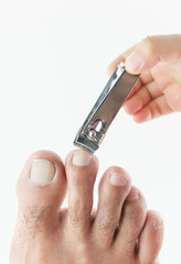 nail clipper cutting man toenails by little hand