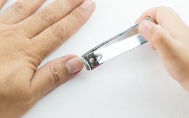 nail clipper cutting man fingernail by little hand