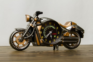 Plakat watch toy in the form of a motorcycle