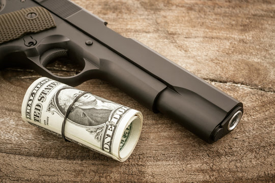 Close up money with Gun.